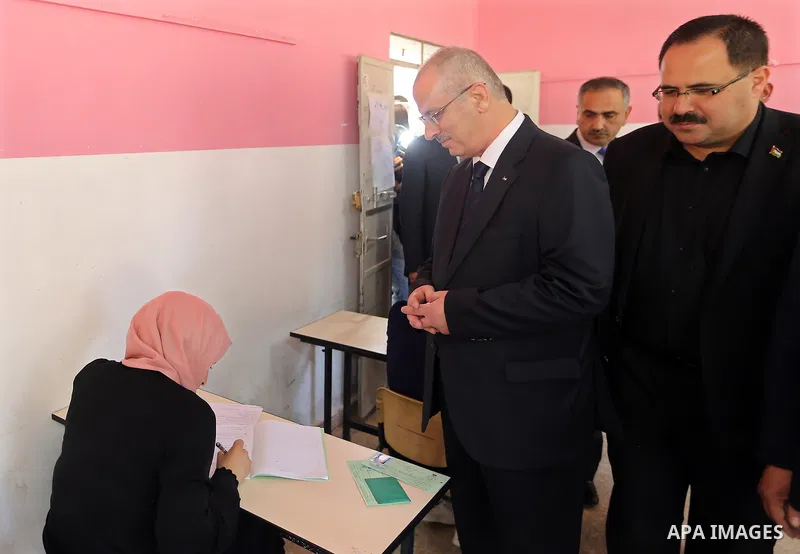 Palestinian Prime Minister Rami Hamdallah visits a school during the first day of high school exams, known as "Tawjihi" in the West Bank city of Nablus on June 03, 2017. Photo by Prime Minister Office