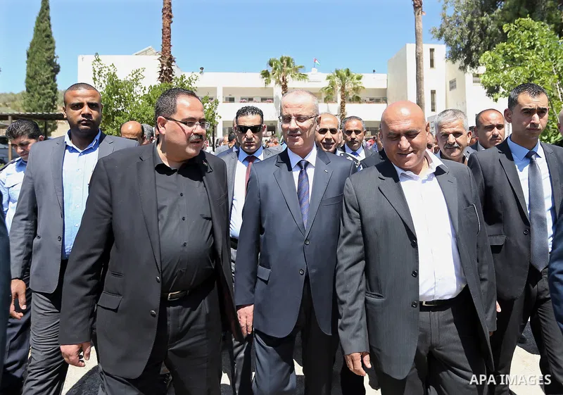 Palestinian Prime Minister Rami Hamdallah visits a school during the first day of high school exams, known as "Tawjihi" in the West Bank city of Nablus on June 03, 2017. Photo by Prime Minister Office