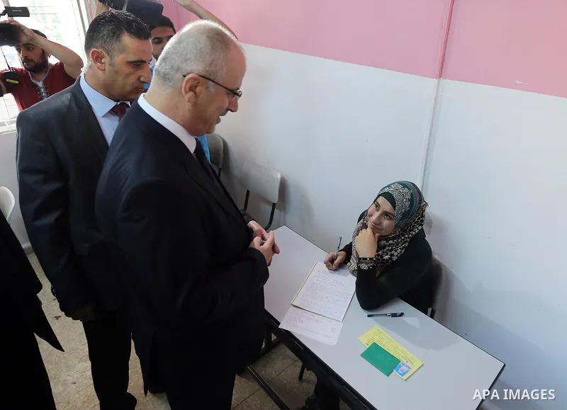 Palestinian Prime Minister Rami Hamdallah visits a school during the first day of high school exams, known as "Tawjihi" in the West Bank city of Nablus on June 03, 2017. Photo by Prime Minister Office
