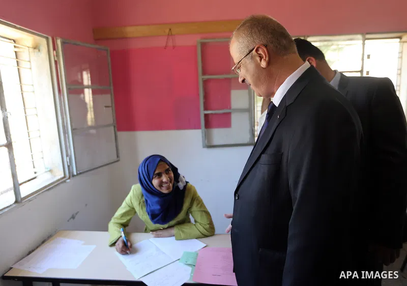 Palestinian Prime Minister Rami Hamdallah visits a school during the first day of high school exams, known as "Tawjihi" in the West Bank city of Nablus on June 03, 2017. Photo by Prime Minister Office