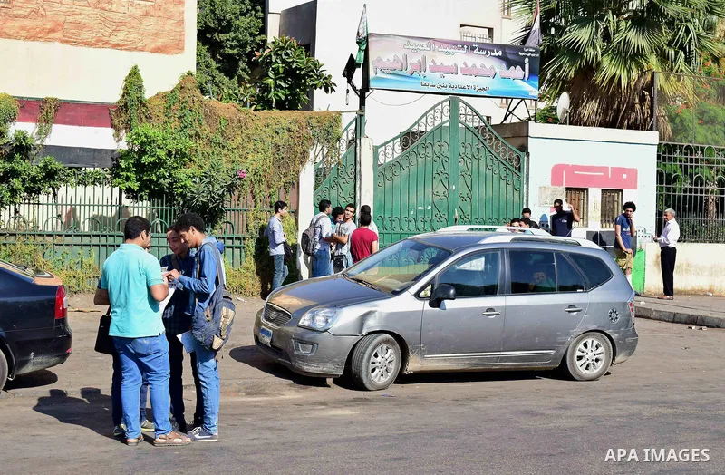 Egyptian students stand outside their school in the first day of high school exams, in Cairo, Egypt, on June 04, 2017. Photo by Amr Sayed