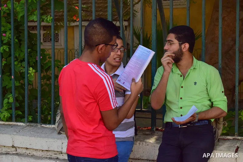 Egyptian students stand outside their school in the first day of high school exams, in Cairo, Egypt, on June 04, 2017. Photo by Amr Sayed