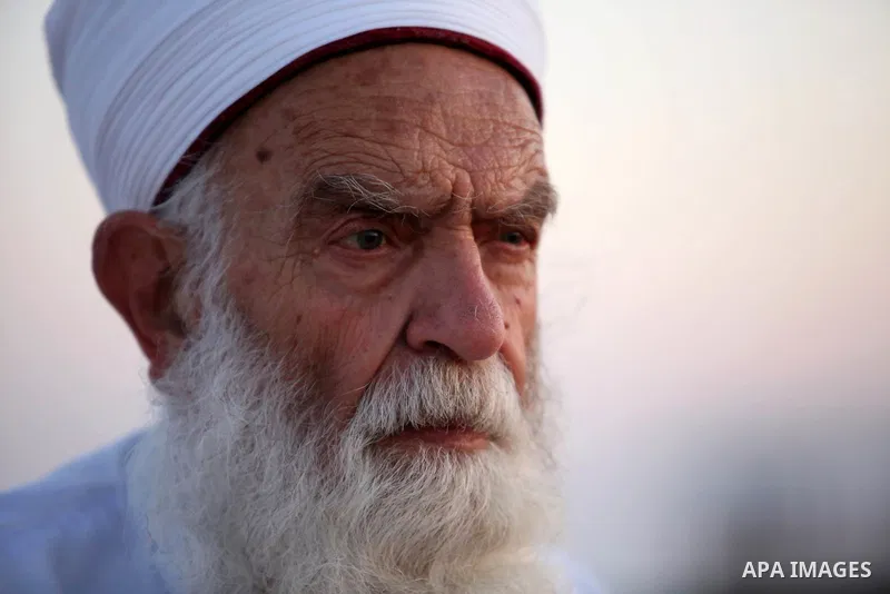 An elderly Samaritan man prays on the top of Mount Gerizim in a traditional pilgrimage to mark the Shavuot's holiday at dawn near the West Bank city of Nablus June 4, 2017 which is giving of the Torah at Mount Sinai seve...