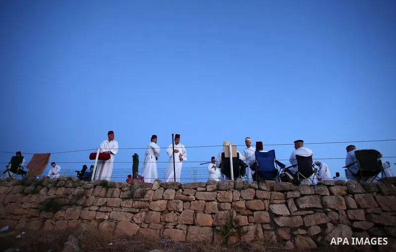 Samaritan worshipers gather to pray on the top of Mount Gerizim in a traditional pilgrimage to mark the Shavuot's holiday at dawn near the West Bank city of Nablus June 4, 2017 which is giving of the Torah at Mount Sinai...