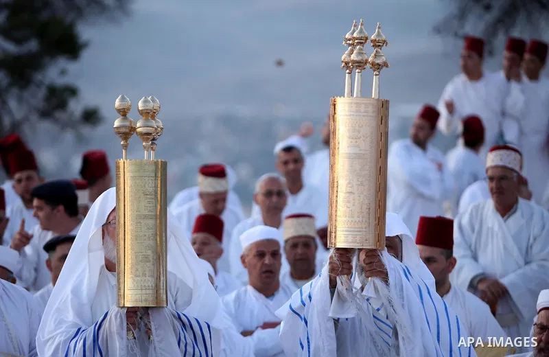 Samaritan worshipers pray on the top of Mount Gerizim in a traditional pilgrimage to mark the Shavuot's holiday at dawn near the West Bank city of Nablus June 4, 2017 which is giving of the Torah at Mount Sinai seven wee...