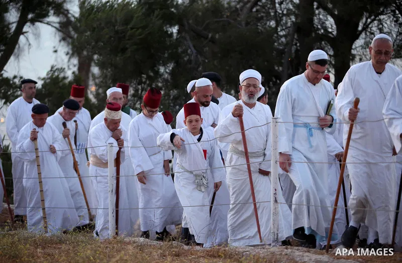 Samaritan worshipers gather to pray on the top of Mount Gerizim in a traditional pilgrimage to mark the Shavuot's holiday at dawn near the West Bank city of Nablus June 4, 2017 which is giving of the Torah at Mount Sinai...
