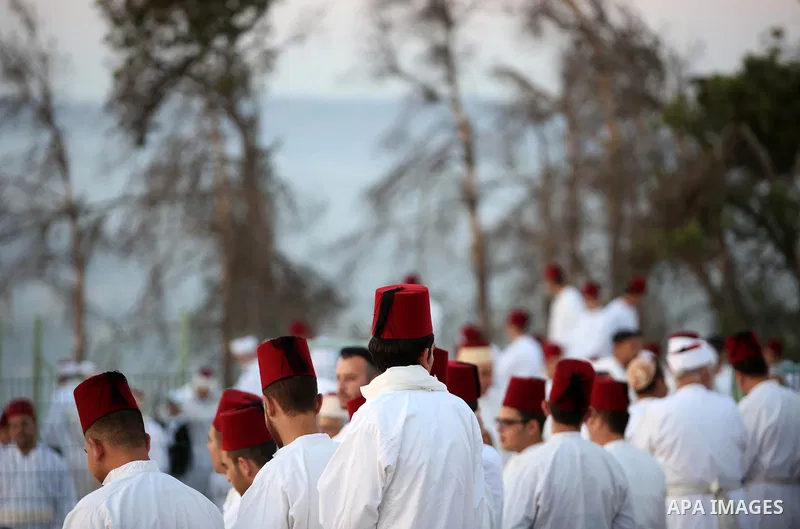 Samaritan worshipers pray on the top of Mount Gerizim in a traditional pilgrimage to mark the Shavuot's holiday at dawn near the West Bank city of Nablus June 4, 2017 which is giving of the Torah at Mount Sinai seven wee...