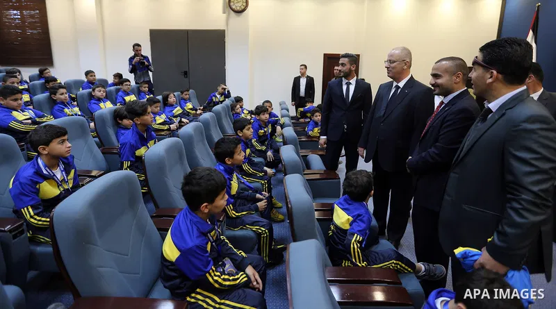 Palestinian Prime Minister Rami Hamdallah meets with children of Champions club, in the West Bank city of Ramallah on June 05, 2017. Photo by Prime Minister Office