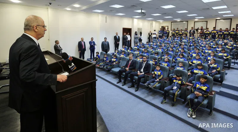 Palestinian Prime Minister Rami Hamdallah speaks during a meeting with children of Champions club, in the West Bank city of Ramallah on June 05, 2017. Photo by Prime Minister Office