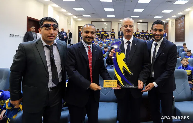 Palestinian Prime Minister Rami Hamdallah meets with children of Champions club, in the West Bank city of Ramallah on June 05, 2017. Photo by Prime Minister Office