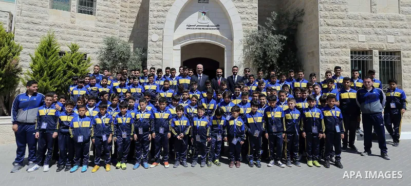 Palestinian Prime Minister Rami Hamdallah meets with children of Champions club, in the West Bank city of Ramallah on June 05, 2017. Photo by Prime Minister Office