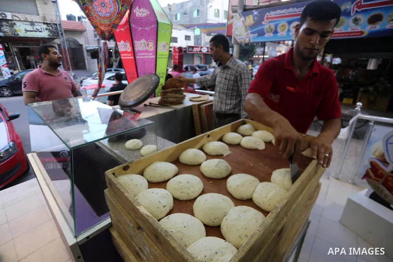 A Palestinian vendor prepares traditional bread known as "saj" for breakfasting on the Muslim holy fasting month of Ramadan in Gaza city on June 6, 2017. Ramadan is sacred to Muslims because it is during that month that...