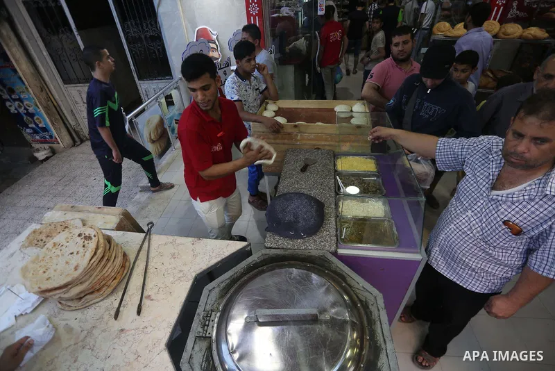 A Palestinian vendor prepares traditional bread known as "saj" for breakfasting on the Muslim holy fasting month of Ramadan in Gaza city on June 6, 2017. Ramadan is sacred to Muslims because it is during that month that...