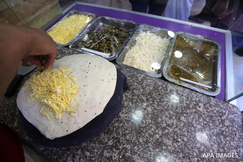 A Palestinian vendor prepares traditional bread known as "saj" for breakfasting on the Muslim holy fasting month of Ramadan in Gaza city on June 6, 2017. Ramadan is sacred to Muslims because it is during that month that...