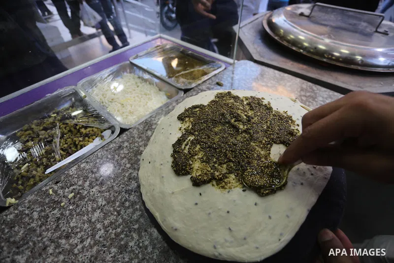 A Palestinian vendor prepares traditional bread known as "saj" for breakfasting on the Muslim holy fasting month of Ramadan in Gaza city on June 6, 2017. Ramadan is sacred to Muslims because it is during that month that...