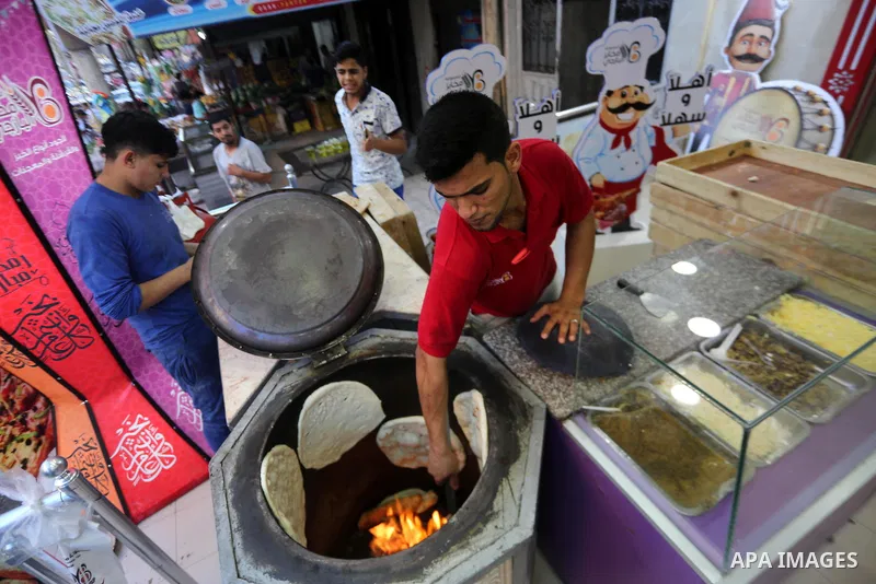 A Palestinian vendor prepares traditional bread known as "saj" for breakfasting on the Muslim holy fasting month of Ramadan in Gaza city on June 6, 2017. Ramadan is sacred to Muslims because it is during that month that...