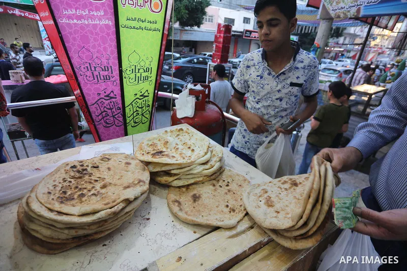 A Palestinian vendor prepares traditional bread known as "saj" for breakfasting on the Muslim holy fasting month of Ramadan in Gaza city on June 6, 2017. Ramadan is sacred to Muslims because it is during that month that...