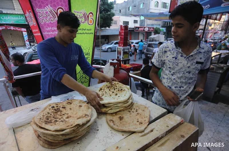 A Palestinian vendor prepares traditional bread known as "saj" for breakfasting on the Muslim holy fasting month of Ramadan in Gaza city on June 6, 2017. Ramadan is sacred to Muslims because it is during that month that...