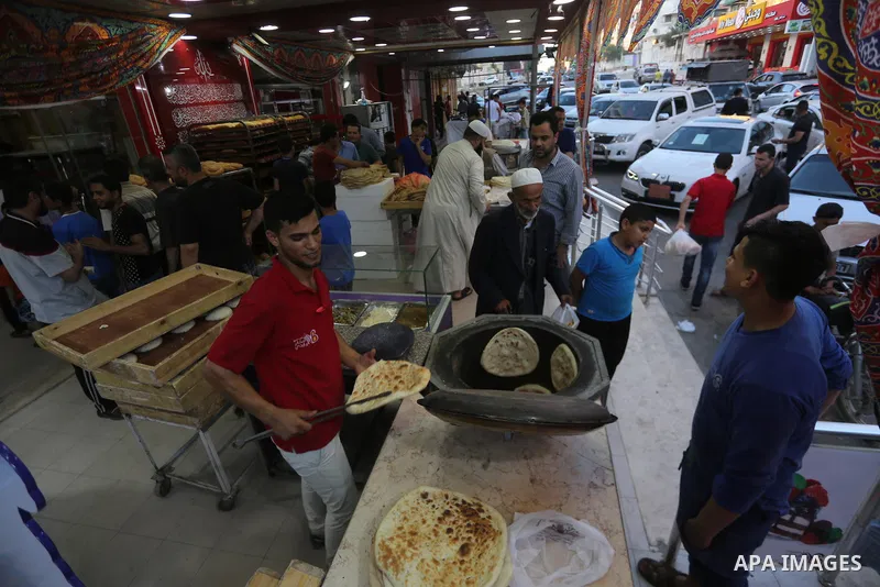 A Palestinian vendor prepares traditional bread known as "saj" for breakfasting on the Muslim holy fasting month of Ramadan in Gaza city on June 6, 2017. Ramadan is sacred to Muslims because it is during that month that...
