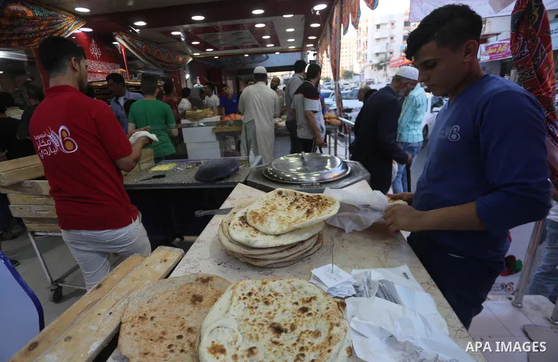 A Palestinian vendor prepares traditional bread known as "saj" for breakfasting on the Muslim holy fasting month of Ramadan in Gaza city on June 6, 2017. Ramadan is sacred to Muslims because it is during that month that...