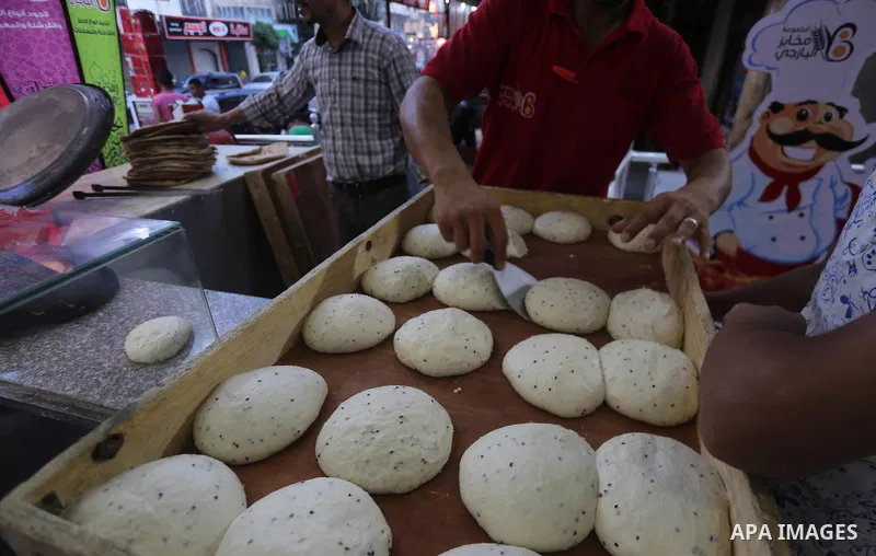 A Palestinian vendor prepares traditional bread known as "saj" for breakfasting on the Muslim holy fasting month of Ramadan in Gaza city on June 6, 2017. Ramadan is sacred to Muslims because it is during that month that...