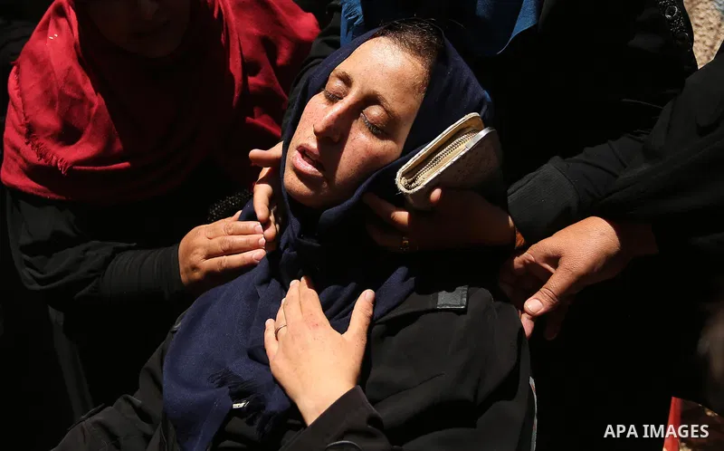 Palestinian women react during the funeral of a 25-year-old Palestinian Fadi al-Najjar who was killed by Israeli fire in the Gaza Strip during clashes with Israeli sceurity forces at the border fence the previous day, in...