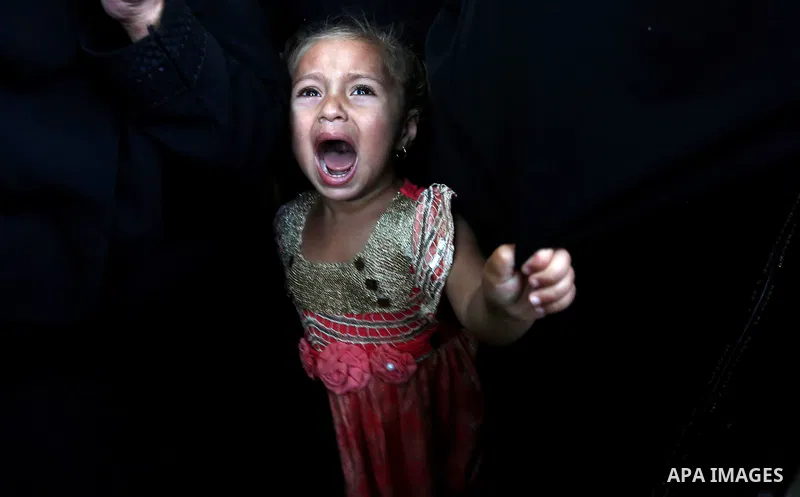 A Palestinian girls reacts during the funeral of a 25-year-old Palestinian Fadi al-Najjar who was killed by Israeli fire in the Gaza Strip during clashes with Israeli sceurity forces at the border fence the previous day,...