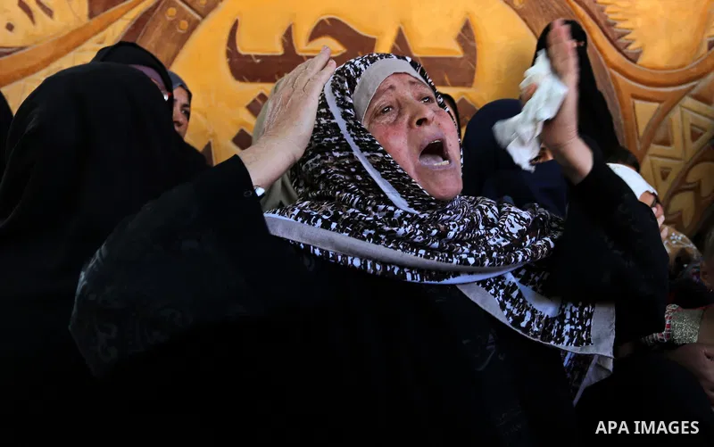 A Palestinian woman reacts during the funeral of a 25-year-old Palestinian Fadi al-Najjar who was killed by Israeli fire in the Gaza Strip during clashes with Israeli sceurity forces at the border fence the previous day,...