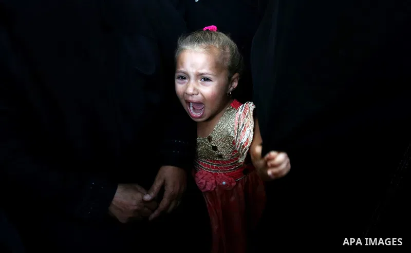 A Palestinian girls reacts during the funeral of a 25-year-old Palestinian Fadi al-Najjar who was killed by Israeli fire in the Gaza Strip during clashes with Israeli sceurity forces at the border fence the previous day,...