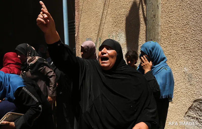 A Palestinian woman reacts during the funeral of a 25-year-old Palestinian Fadi al-Najjar who was killed by Israeli fire in the Gaza Strip during clashes with Israeli sceurity forces at the border fence the previous day,...