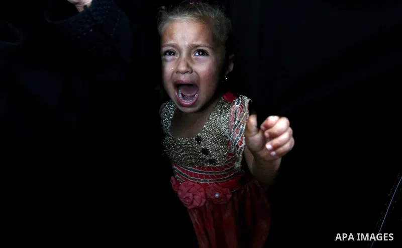 A Palestinian girls reacts during the funeral of a 25-year-old Palestinian Fadi al-Najjar who was killed by Israeli fire in the Gaza Strip during clashes with Israeli sceurity forces at the border fence the previous day,...