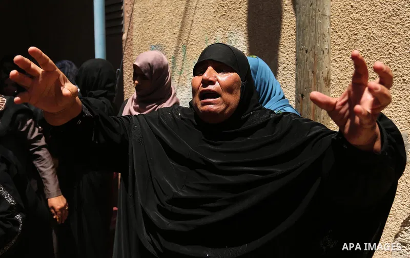 A Palestinian woman reacts during the funeral of a 25-year-old Palestinian Fadi al-Najjar who was killed by Israeli fire in the Gaza Strip during clashes with Israeli sceurity forces at the border fence the previous day,...