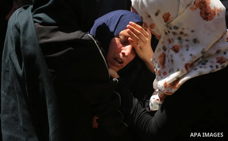 Palestinian women react during the funeral of a 25-year-old Palestinian Fadi al-Najjar who was killed by Israeli fire in the Gaza Strip during clashes with Israeli sceurity forces at the border fence the previous day, in...