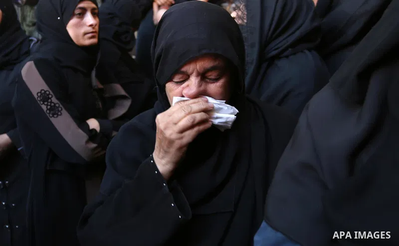 A Palestinian woman reacts during the funeral of a 25-year-old Palestinian Fadi al-Najjar who was killed by Israeli fire in the Gaza Strip during clashes with Israeli sceurity forces at the border fence the previous day,...