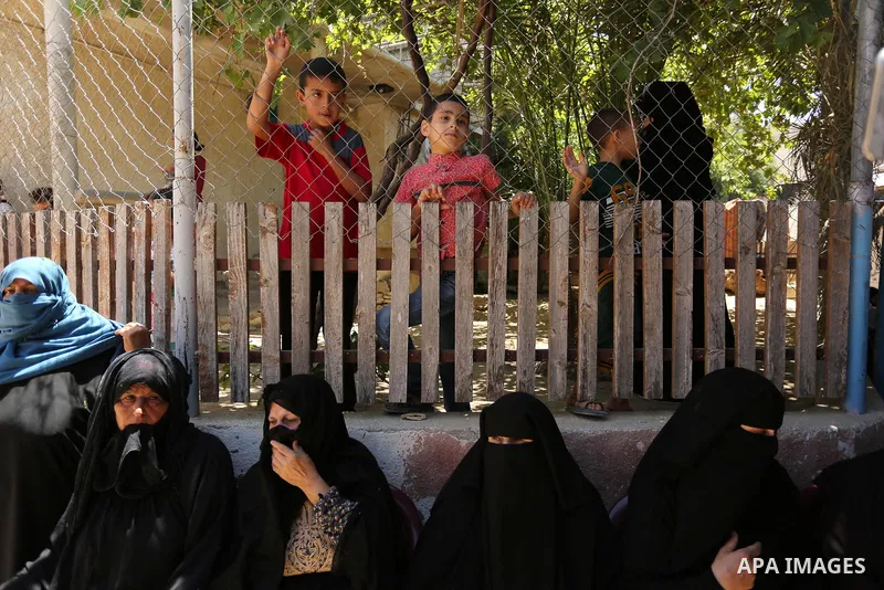 Mourners wait for the funeral of a 25-year-old Palestinian Fadi al-Najjar who was killed by Israeli fire in the Gaza Strip during clashes with Israeli sceurity forces at the border fence the previous day, in Khan Younis...