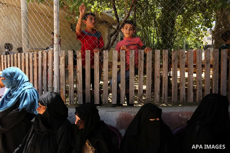 Mourners wait for the funeral of a 25-year-old Palestinian Fadi al-Najjar who was killed by Israeli fire in the Gaza Strip during clashes with Israeli sceurity forces at the border fence the previous day, in Khan Younis...