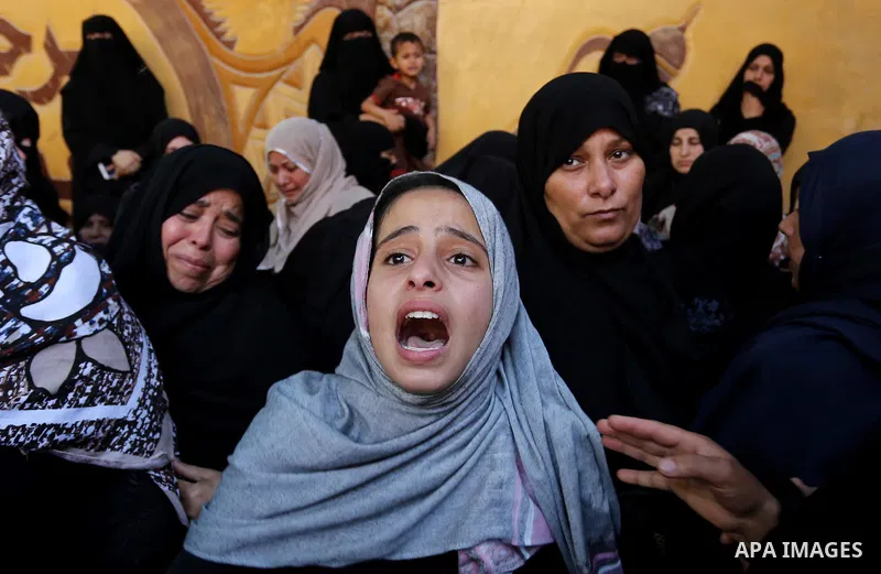 Palestinian women react during the funeral of a 25-year-old Palestinian Fadi al-Najjar who was killed by Israeli fire in the Gaza Strip during clashes with Israeli sceurity forces at the border fence the previous day, in...