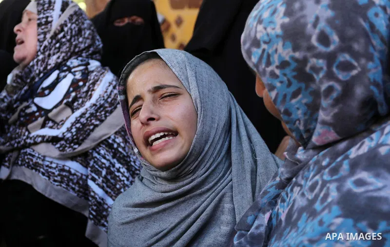 Palestinian women react during the funeral of a 25-year-old Palestinian Fadi al-Najjar who was killed by Israeli fire in the Gaza Strip during clashes with Israeli sceurity forces at the border fence the previous day, in...