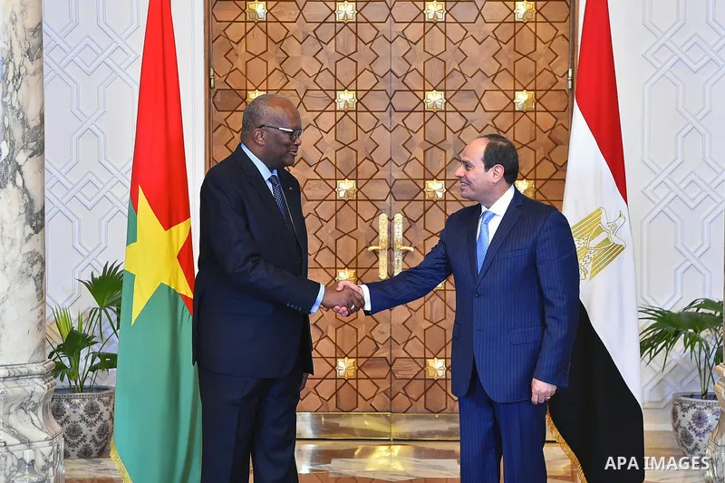 Egyptian President Abdel Fattah al-Sisi shakes hands with President of Burkina Faso, Roch Marc Christian Kabore in Cairo, Egypt, on June 07, 2017. Photo by Egyptian President Office
