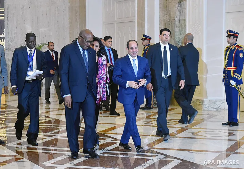 Egyptian President Abdel Fattah al-Sisi walks alongside with President of Burkina Faso, Roch Marc Christian Kabore in Cairo, Egypt, on June 07, 2017. Photo by Egyptian President Office