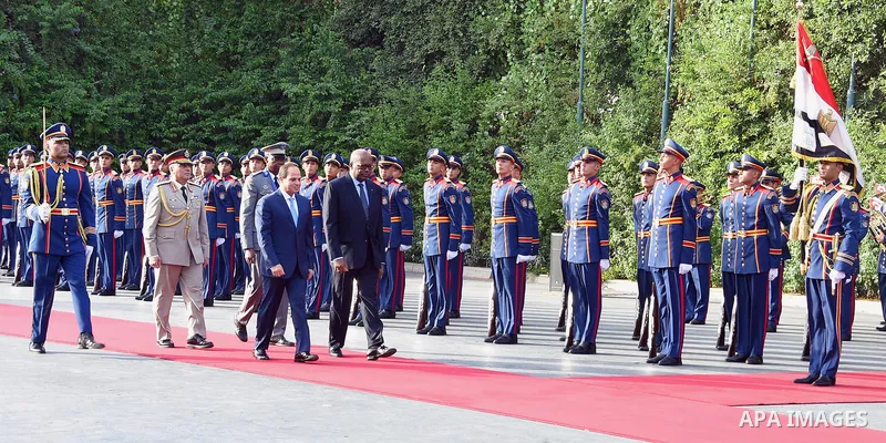 Egyptian President Abdel Fattah al-Sisi and President of Burkina Faso, Roch Marc Christian Kabore review the honor guards in Cairo, Egypt, on June 07, 2017. Photo by Egyptian President Office