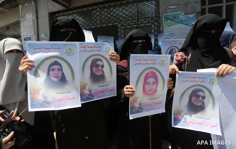 Palestinian women take part in a protest to show solidarity with Palestinian female prisoners held in Israeli jails, in Gaza city on June 08, 2017. Photo by Mohammed Asad