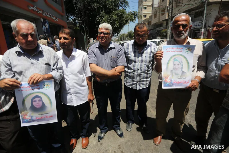 Palestinian men take part in a protest to show solidarity with Palestinian female prisoners held in Israeli jails, in Gaza city on June 08, 2017. Photo by Mohammed Asad