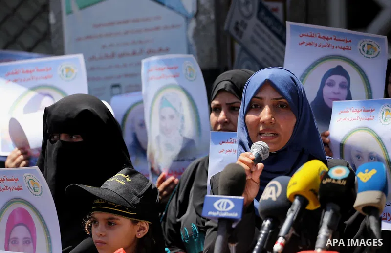 Palestinian women take part in a protest to show solidarity with Palestinian female prisoners held in Israeli jails, in Gaza city on June 08, 2017. Photo by Mohammed Asad