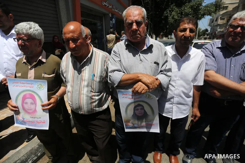 Palestinian men take part in a protest to show solidarity with Palestinian female prisoners held in Israeli jails, in Gaza city on June 08, 2017. Photo by Mohammed Asad