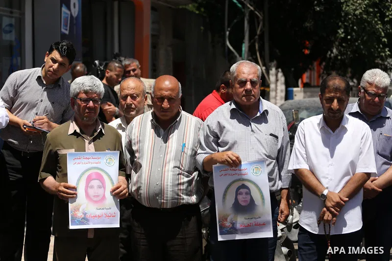 Palestinian men take part in a protest to show solidarity with Palestinian female prisoners held in Israeli jails, in Gaza city on June 08, 2017. Photo by Mohammed Asad
