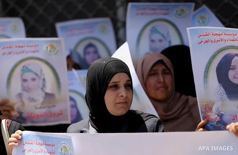 Palestinian women take part in a protest to show solidarity with Palestinian female prisoners held in Israeli jails, in Gaza city on June 08, 2017. Photo by Mohammed Asad