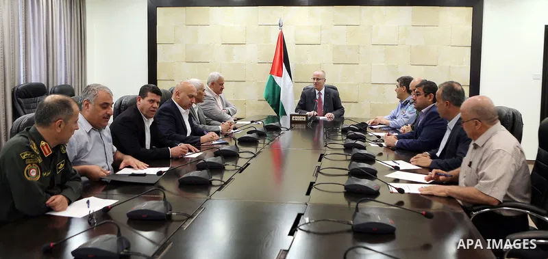 Palestinian Prime Minister Rami Hamdallah chairs a meeting with security chiefs, in the West Bank city of Ramallah on June 08, 2017. Photo by Prime Minister Office