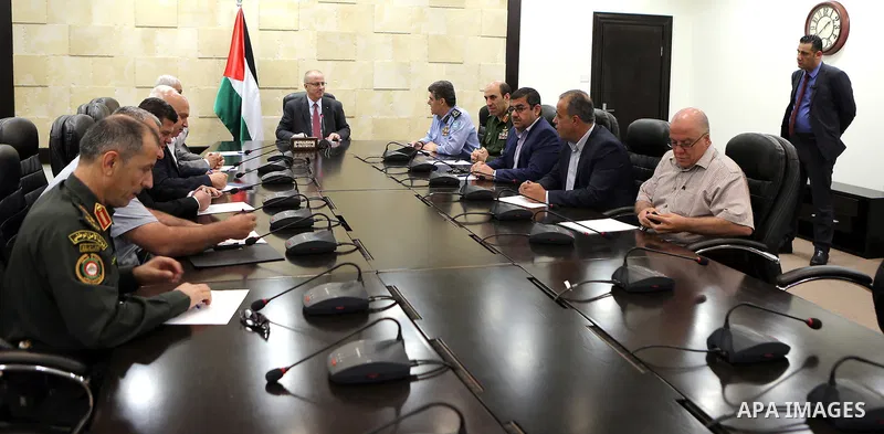 Palestinian Prime Minister Rami Hamdallah chairs a meeting with security chiefs, in the West Bank city of Ramallah on June 08, 2017. Photo by Prime Minister Office