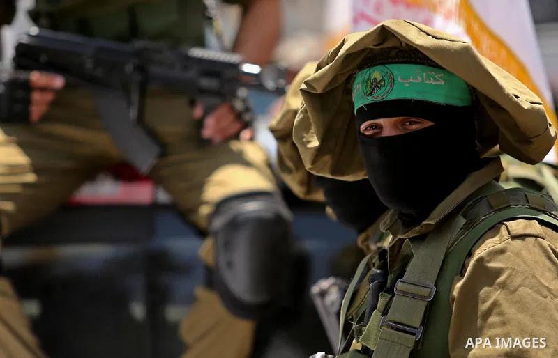 Members of the Ezzedine al-Qassam Brigades, the military wing of the Palestinian Islamist movement Hamas, attend the funeral of their comrade Ibrahim Abu Al-Naja in Rafah, southern Gaza Strip June 8, 2017. Photo by Ashra...